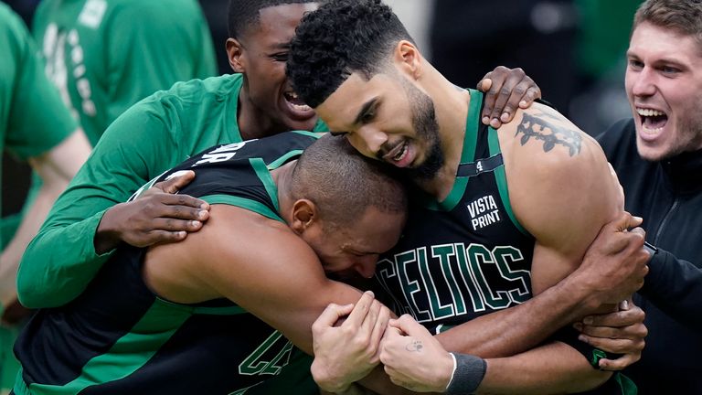 Boston Celtics center Al Horford, front left, and forward Jayson Tatum, front right, celebrate after Tatum made a layup at the buzzer to score and win Game 1 of an NBA basketball first-round Eastern Conference playoff series against the Brooklyn Nets, Sunday, April 17, 2022, in Boston. The Celtics won 115-114