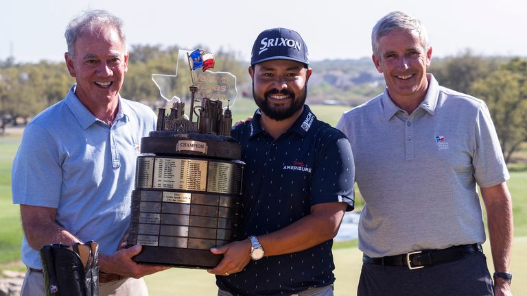 JJ Spaun is presented with the Valero Texas Open trophy