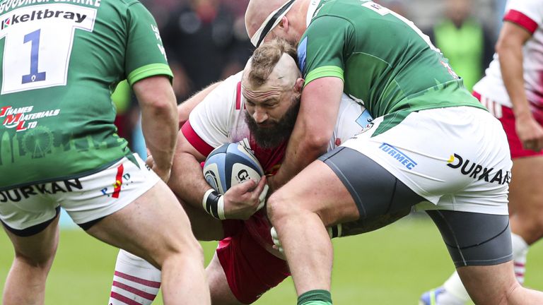 London Irish's Ollie Hoskins tackles Harlequins' Joe Marler