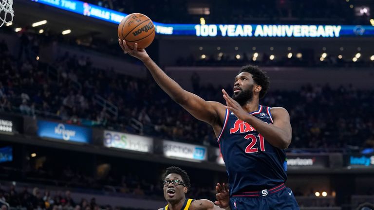 Philadelphia 76ers&#39; Joel Embiid shoots against Indiana Pacers&#39; Jalen Smith during the first half of an NBA basketball game Tuesday, April 5, 2022, in Indianapolis. (AP Photo/Darron Cummings)