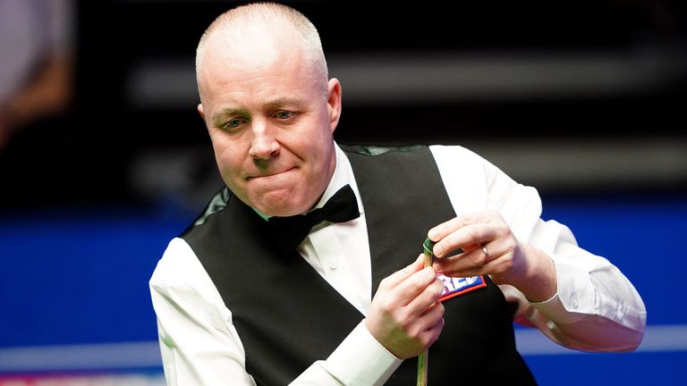 Scotland's John Higgins in action against Thailand's Noppon Saengkham during day ten of the Betfred World Snooker Championships at The Crucible, Sheffield. Picture date: Monday April 25, 2022.