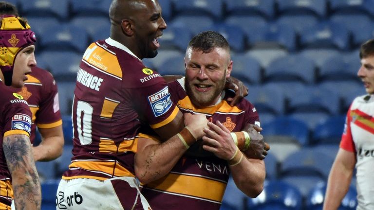 Picture by John Rushworth/SWpix.com - 01/04/2022 - Rugby League - Betfred Super League Round 7 - Huddersfield Giants v Catalans Dragons - John Smith's Stadium, Huddersfield, England - Huddersfield Giants' Josh Jones (right) celebrates scoring his sides fourth try