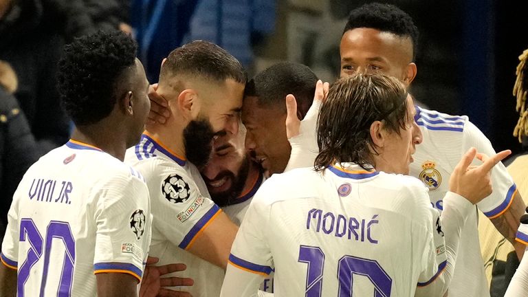 Karim Benzema celebrates scoring his hat-trick vs Chelsea