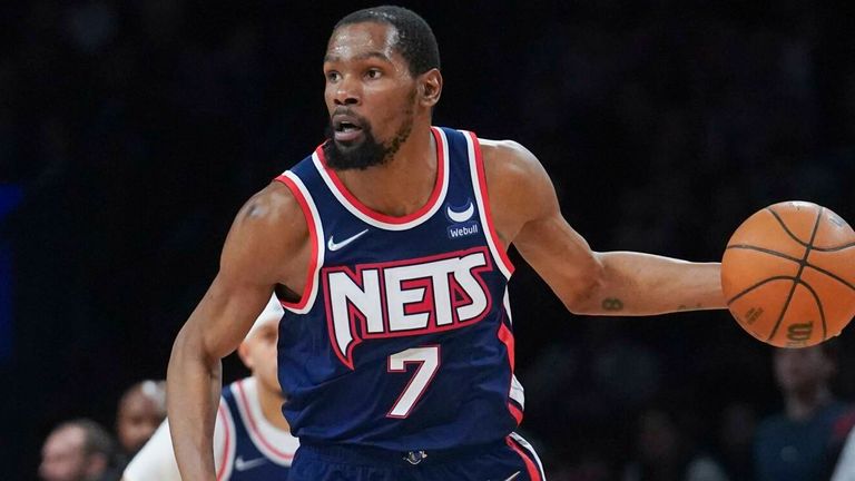 Brooklyn Nets forward Kevin Durant dribbles down court during fourth period NBA game against Cleveland Cavaliers in April 2022