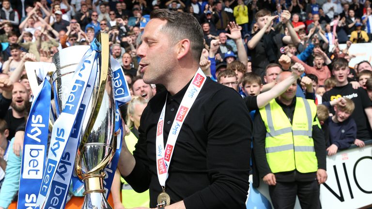 Wigan manager Leam Richardson celebrates winning League One