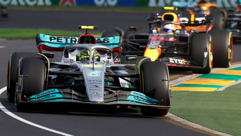 Lewis Hamilton races ahead of Red Bull's Sergio Perez at the Australian GP