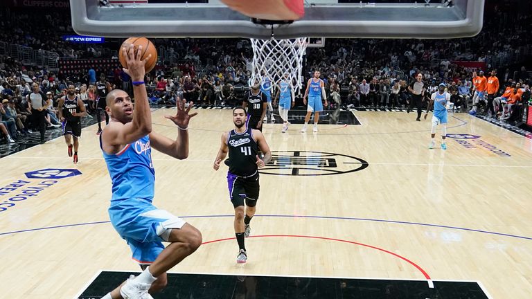 Los Angeles Clippers forward Nicolas Batum scores during the second half of an NBA basketball game against the Sacramento Kings