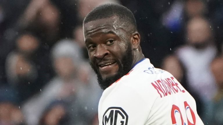 Lyon&#39;s Tanguy Ndombele walks on the pitch during the French League One soccer match between Lyon and Rennes, in Lyon, central France, Sunday, March 13, 2022. (AP Photo/Laurent Cipriani)