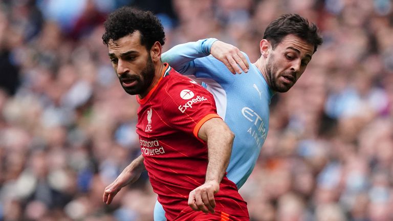 Liverpool&#39;s Mohamed Salah (left) and Manchester City&#39;s Bernardo Silva battle for the ball