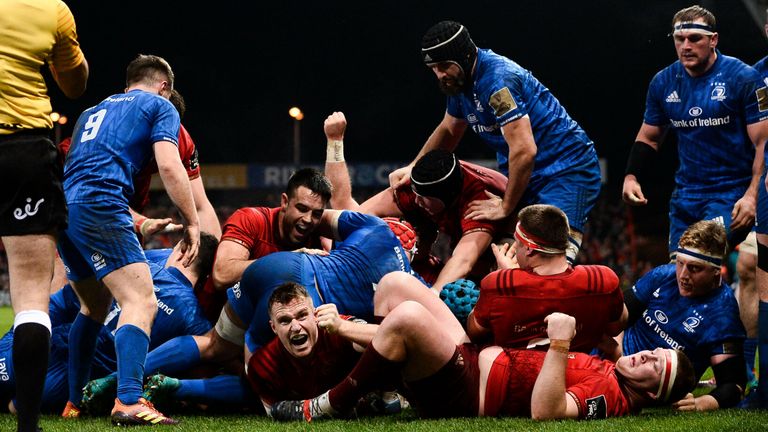 Munster celebrate their opening try as openside flanker Chris Cloete (hidden) touched down via a rolling maul try