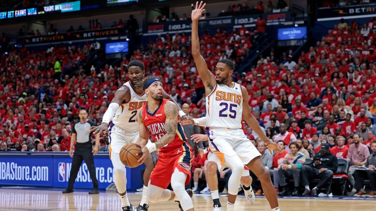 Phoenix Suns forward Mikal Bridges (25) defends against New Orleans Pelicans guard Jose Alvarado (15) during the first half of Game 3 of an NBA basketball first-round playoff series in New Orleans, Friday, April 22, 2022.