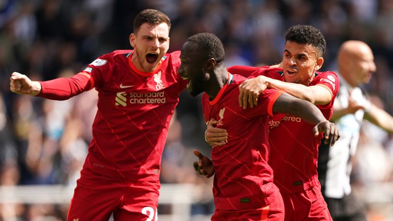 Liverpool prophet (center) Keita celebrates the first goal of his team's game with teammates Andrew Robertson (left) and Luis Diaz (right).