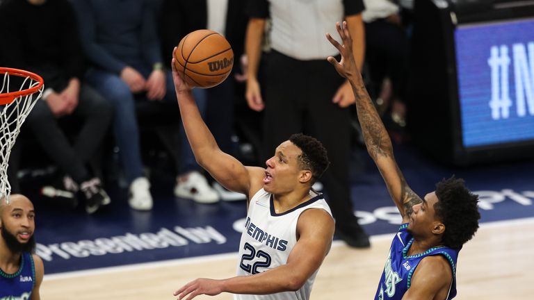 PRIL 29: Desmond Bane #22 of the Memphis Grizzlies goes up for a shot past Jaden McDaniels #3 of the Minnesota Timberwolves in the fourth quarter during Game Six of the Western Conference First Round at Target Center on April 29, 2022 in Minneapolis, Minnesota. The Grizzlies defeated the Timberwolves 114-106 to advance to the Western Conference Semifinals.