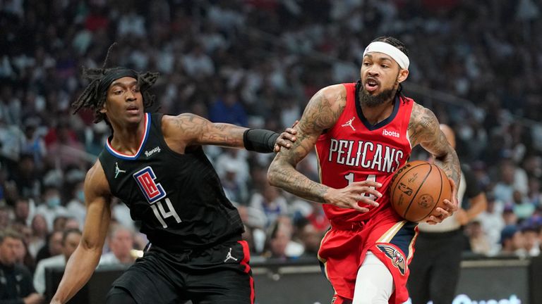 New Orleans Pelicans forward Brandon Ingram, right, drives past Los Angeles Clippers guard Terance Mann during the first half of an NBA basketball play-in tournament game Friday, April 15, 2022, in Los Angeles. 