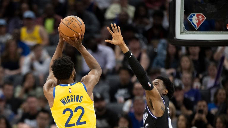 Golden State Warriors forward Andrew Wiggins (22) scores over Sacramento Kings guard Josh Jackson (55) during the second half 