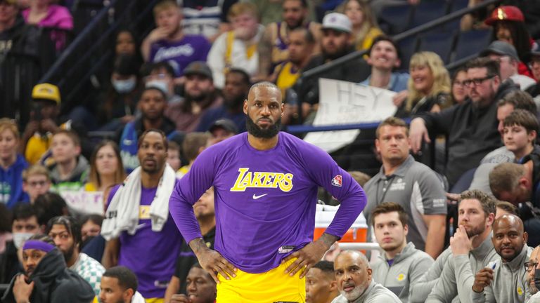 Los Angeles Lakers forward LeBron James looks on from the bench during an NBA basketball game against the Minnesota Timberwolves
