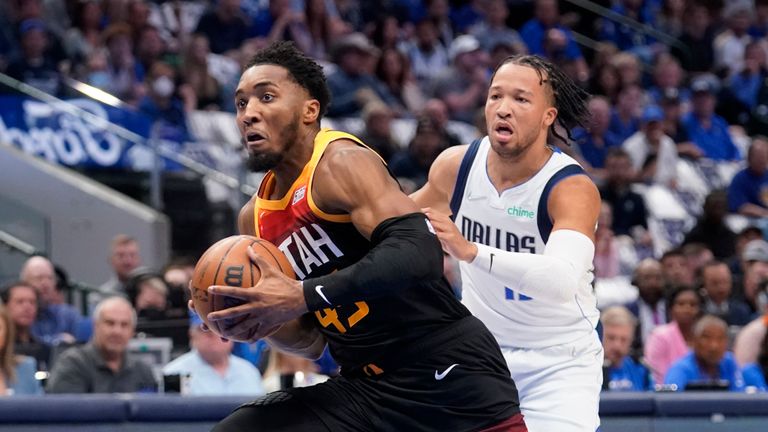Utah Jazz guard Donovan Mitchell (45) drives to the basket past Dallas Mavericks guard Jalen Brunson, right, in the first half of Game 2 of an NBA basketball first-round playoff series, Monday, April 18, 2022, in Dallas.