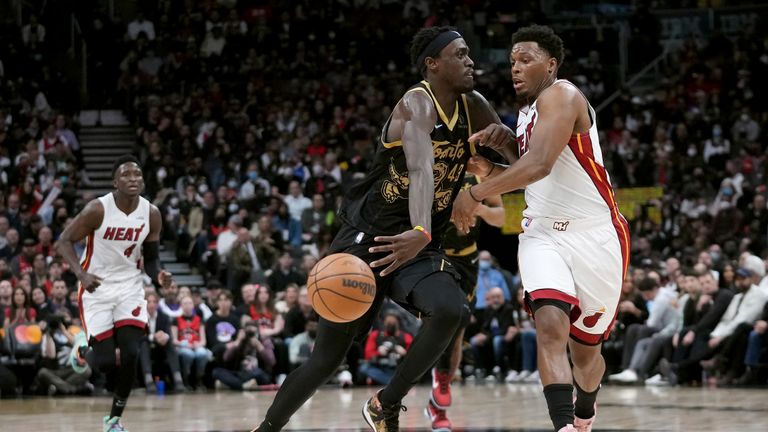 Toronto Raptors forward Pascal Siakam (43) is defended by Miami Heat guard Kyle Lowry during the first half of an NBA basketball game