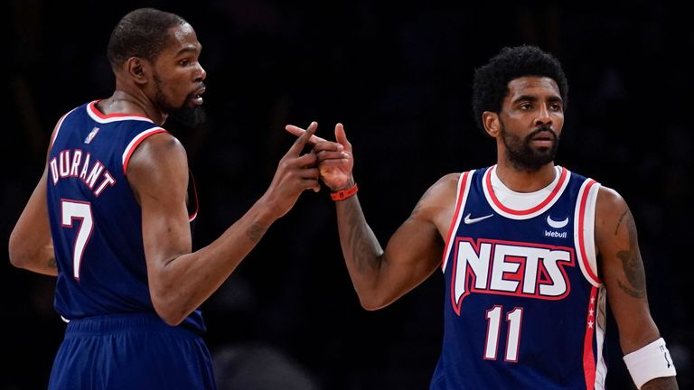 Brooklyn Nets' Kyrie Irving, right, and Kevin Durant celebrate after a basket during the second half of an NBA basketball game against the Indiana Pacers at Barclays Center, Sunday, April 10, 2022, in New York.