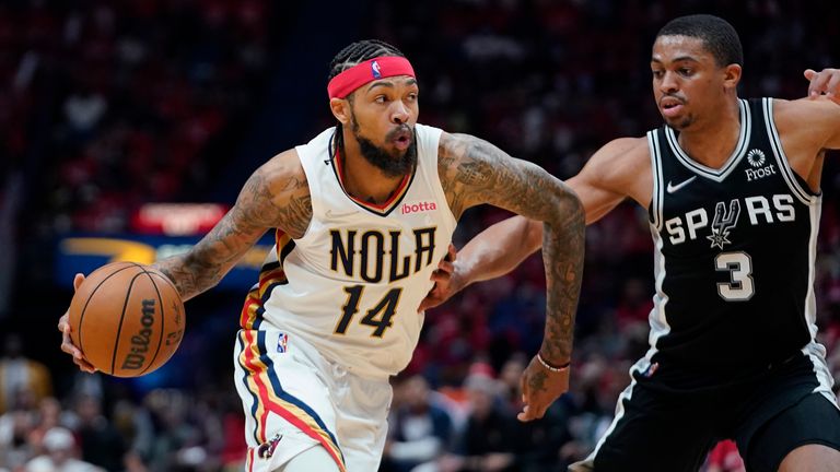 New Orleans Pelicans forward Brandon Ingram drives to the basket against San Antonio Spurs forward Keldon Johnson 