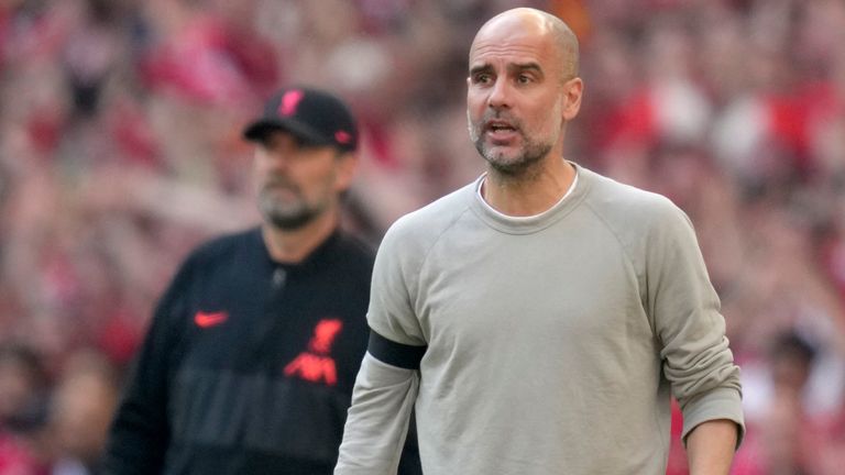 Pep Guardiola and Jurgen Klopp on the touchline at Wembley (AP)