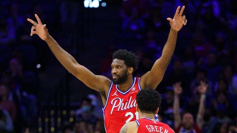 Philadelphia 76ers&#39; Joel Embiid reacts to the basket by Danny Green