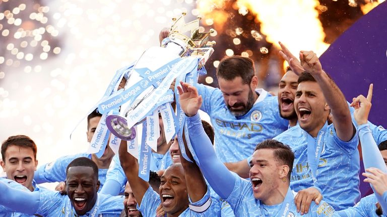 Man City Captain Fernandinho lifting the PL trophy. 