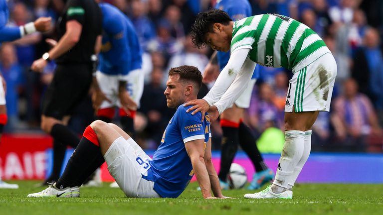GLASGOW, SCOTLAND - APRIL 17: Reo Hatate with the injured Aaron Ramsey during a Scottish Cup Semi-Final between Celtic and Rangers at Hampden Park, on April 17, 2022, in Glasgow, Scotland. (Photo by Craig Williamson / SNS Group)