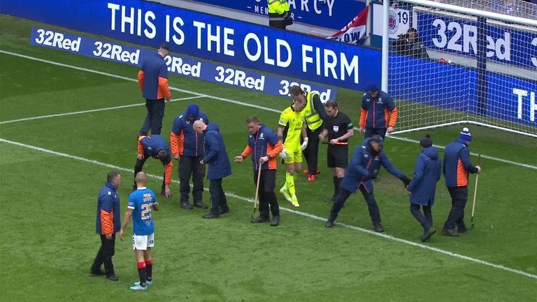 Rangers striker Kemar Roofe helped the stewards as stewards cleared Hart's penalty area