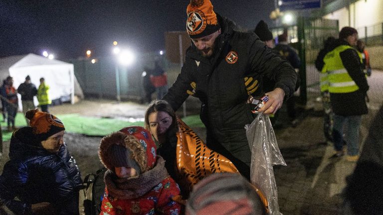 Dundee United’s international business manager Ricardo Cerdan hands out blankets in Ukraine