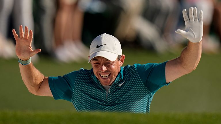 Rory McIlroy reacts after chipping out of a bunker for birdie in the final round