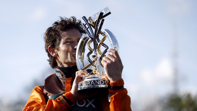 Sam Waley-Cohen kisses the Grand National trophy after winning on Noble Yeats