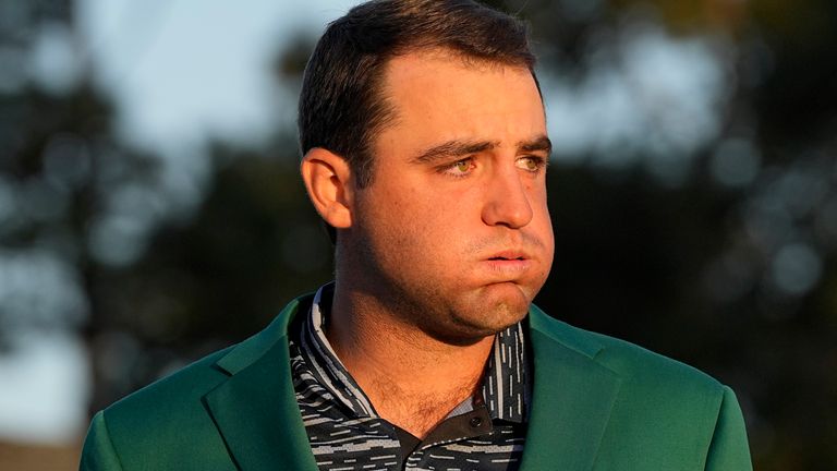 Scottie Scheffler reacts while speaking after putting on his green jacket after winning the 86th Masters golf tournament on Sunday, April 10, 2022, in Augusta, Ga. (AP Photo/David J. Phillip)