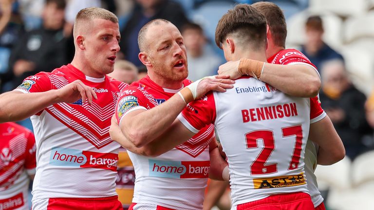 Picture by Alex Whitehead/SWpix.com - 18/04/2022 - Rugby League - Betfred Super League: Round 9 - Huddersfield Giants vs St Helens - The John Smith's Stadium, Huddersfield, England - St Helens’ Jon Benninson is congratulated on their try by James Roby, Joe Batchelor and Jake Wingfield.