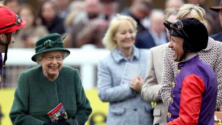 Frankie Dettori and the Queen in good spirits as they speak in the parade ring