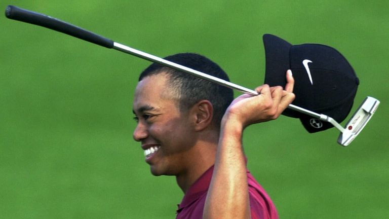 Woods celebrates completing the 'Tiger Slam' in 2001