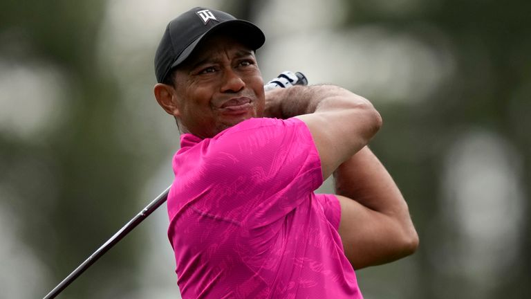 Tiger Woods watches his tee shot on the first hole during the first round at the Masters 