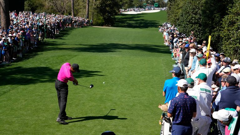 Tiger Woods tees off on the 18th hole during the first round at the Masters