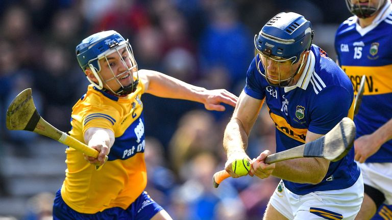 24 April 2022; Jason Forde of Tipperary is tackled by Rory Hayes of Clare during the Munster GAA Hurling Senior Championship Round 2 match between Tipperary and Clare at FBD Semple Stadium in Thurles, Tipperary. Photo by Ray McManus/Sportsfile