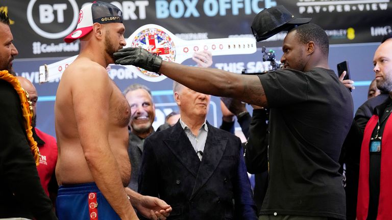 British heavyweight boxers Tyson Fury and Dillian Whyte go head-to-head as they take part in their weigh-in at the Boxpark Wembley venue, near Wembley Stadium, in London, Friday, April 22, 2022. Wembley Stadium will stage Tyson Fury...s defense of the WBC heavyweight title against British countryman Dillian Whyte on Saturday. (AP Photo/Matt Dunham)...