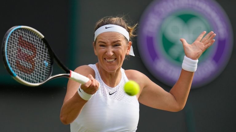 Victoria Azarenka of Belarus plays a return to Romania's Sorana Cirstea during the women's singles second round match on day four of the Wimbledon Tennis Championships in London, Thursday July 1, 2021. (AP Photo/Kirsty Wigglesworth)