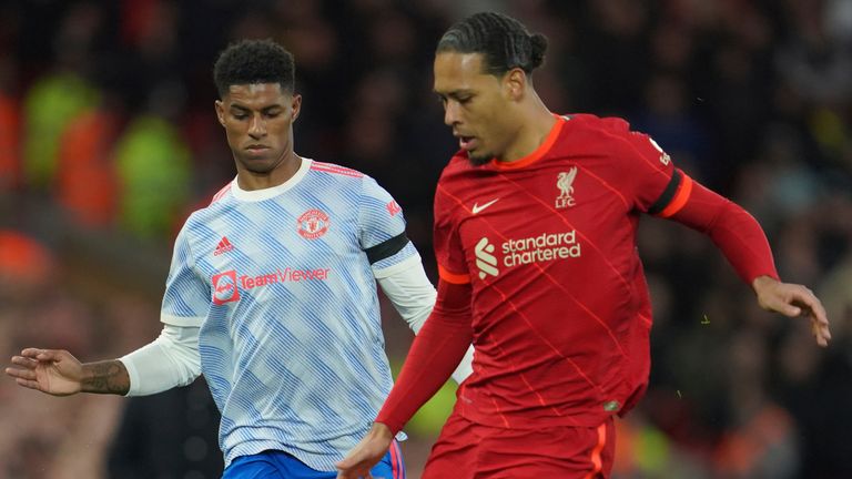 Liverpool&#39;s Virgil van Dijk is challenged by Manchester United&#39;s Marcus Rashford  (AP)