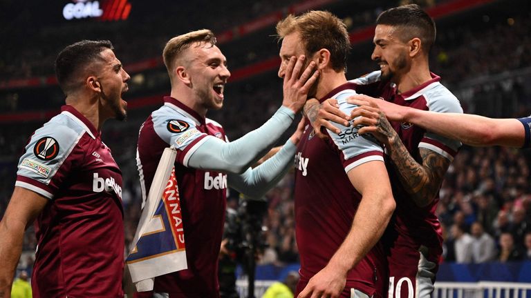 West Ham's Craig Dawson celebrates with team-mates after scoring against Lyon
