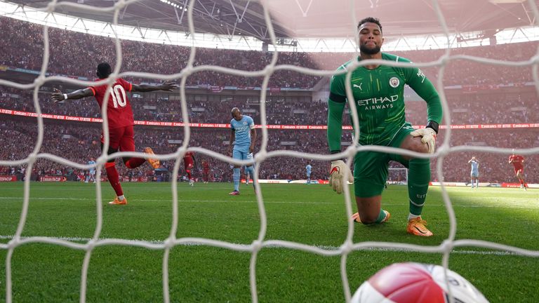 Manchester City goalkeeper Zack Steffen looks on as an error leads to Liverpool's Sadio Mane scoring Liverpool's second