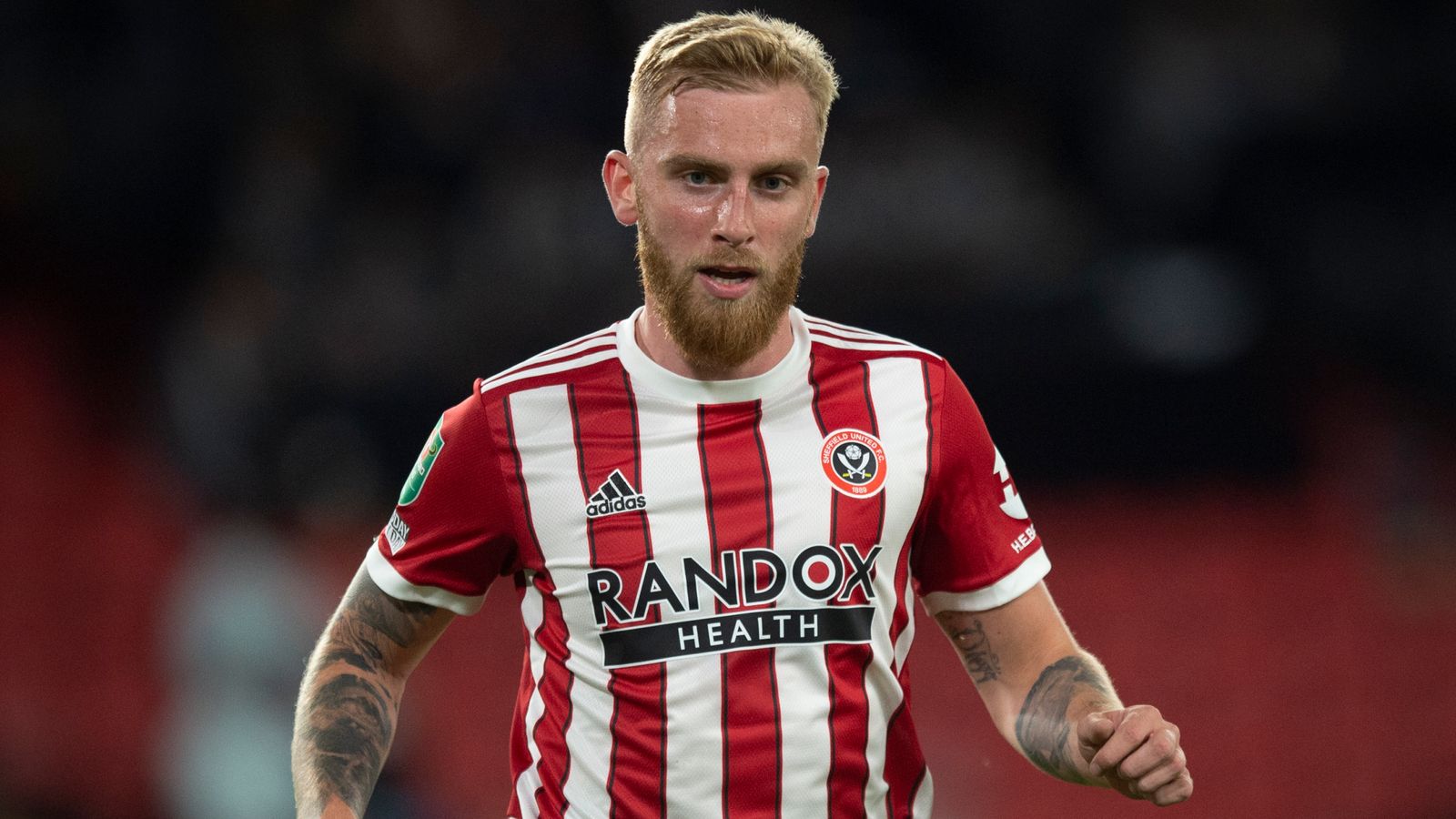 Sheff Utd's Oli McBurnie appears to kick fan during pitch invasion at Nottingham..
