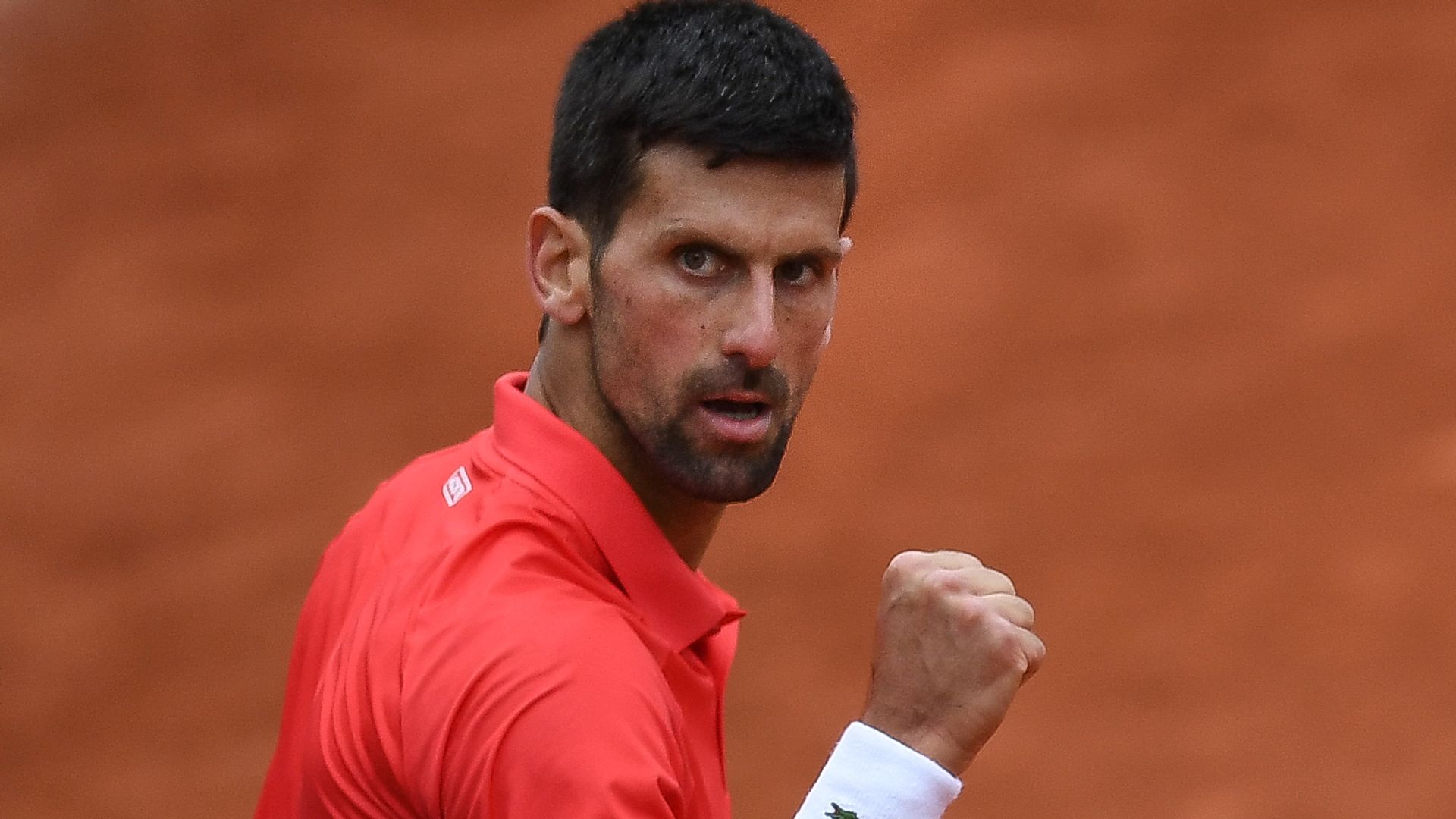 Djokovic jeered but into French Open quarter-finals where he faces Nadal