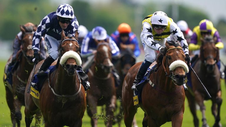 Dakota Gold and Connor Beasley (right) coming home to win the Churchill Tyres Handicap during day one of the Dante Festival 2022 at York racecourse. Picture date: Wednesday May 11, 2021.