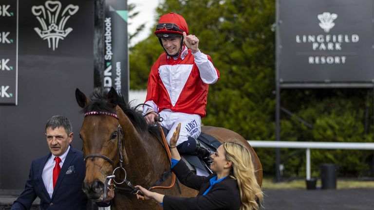 Jockey Jack Mitchell in the winners enclosure after winning the SBK Oaks Trial Fillies' Stakes aboard Rogue Millennium