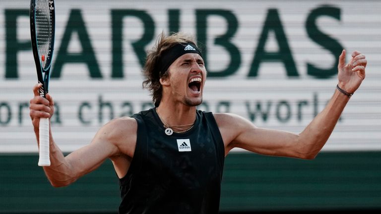 Germany's Alexander Zverev celebrates as he defeats Spain's Carlos Alcaraz during their quarterfinal match of the French Open tennis tournament at the Roland Garros stadium Tuesday, May 31, 2022 in Paris. Zverev won 6-4-, 6-4, 4-6, 7-6 (9/7). (AP Photo/Thibault Camus)