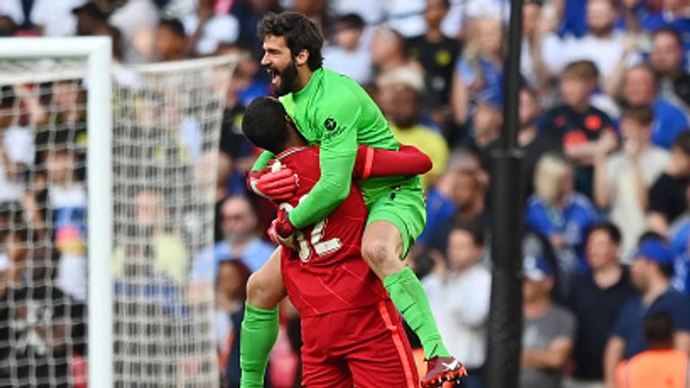 Alisson Becker and Joel Matip celebrate after Liverpool's penalty shootout win